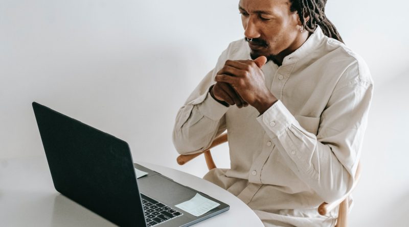 Photo by Alex Green: https://www.pexels.com/photo/serious-black-man-working-on-laptop-in-light-room-5700184/