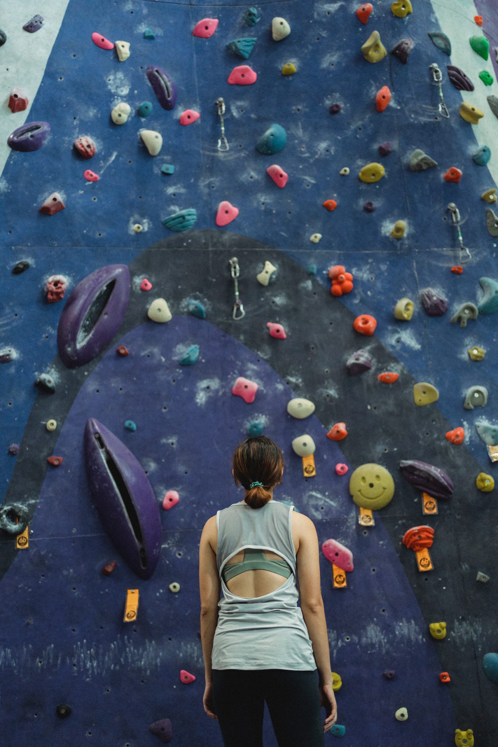 Photo by Allan Mas: https://www.pexels.com/photo/woman-preparing-for-climbing-high-on-wall-5383501/
