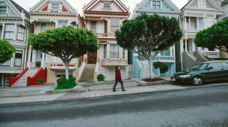 Photo by Belle Co: https://www.pexels.com/photo/woman-walking-toward-black-sedan-parked-in-front-of-colorful-houses-672916/
