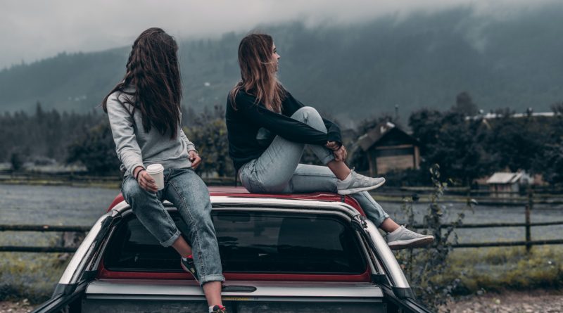Photo by Elijah O'Donnell: https://www.pexels.com/photo/two-women-sitting-on-vehicle-roofs-2409681/