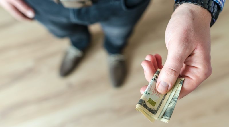 Photo by Lukas: https://www.pexels.com/photo/person-holding-banknote-928184/