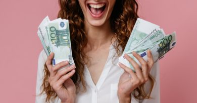 Photo by Pavel Danilyuk: https://www.pexels.com/photo/woman-in-white-button-up-shirt-holding-money-8638312/